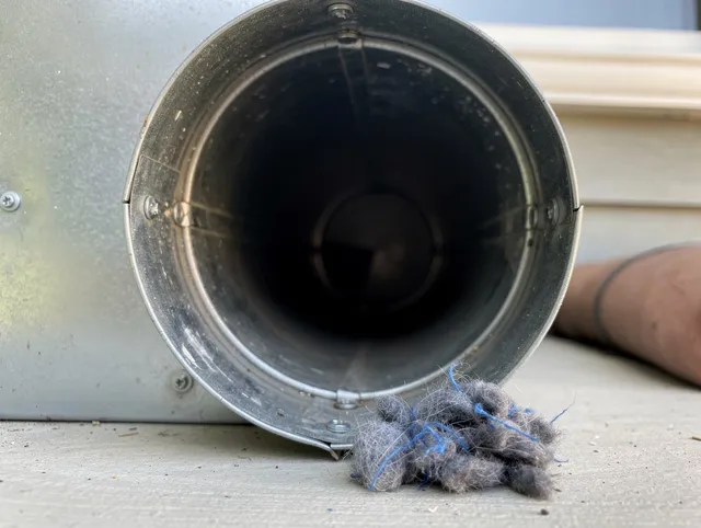 Lyndhurst Dryer Vent Cleaning technician using specialized equipment to clear severe dryer vent blockage in Lyndhurst